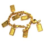 A 22 carat gold bracelet with seven ingots