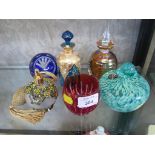 A Guernsey Island studio glass scent bottle together with three other various scent bottles and