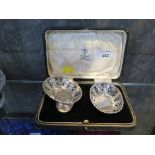 A cased silver pair of small oval shaped bon bon dishes, with fret design, Birmingham 1923