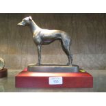 A bronzed figure of a Greyhound standing by Donaldson, Genesis of Ireland, 22cm high