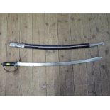 An Indian sword, with engraved blade and velvet covered scabbard, length of blade 74cm