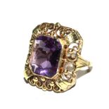 An amethyst ring set in 14 carat gold