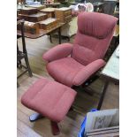 A G-Plan swivel easy armchair and matching footstool
