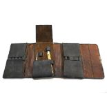 A leather folding case with eleven De Paul scalpels