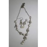 A Guernsey pearl and paste silver necklace and a pair of matching earrings
