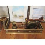 A brass desk compendium in the form of a letterbox 18cm high, a ship's bell, trivet saucepan