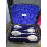 A cased set of four silver fruit serving spoons with pilgrim finials, London 1906