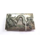 A Chinese silver card case decorated to both sides with a dragon in relief