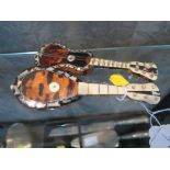 Two tortoisehell and mother of pearl models, of a guitar and a lute, 13.5cm long