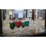 Five cut glass decanters and various drinking glasses