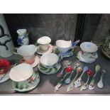 A collection of Franz tea cups, saucers and teaspoons, all various floral designs and a