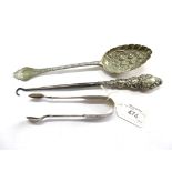 A silver berry spoon, a pair of sugar tongs and a button hook