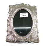 A single silver oval aperture photo frame, with a textured hammered finish, size 12.5cm x 8.5cm,