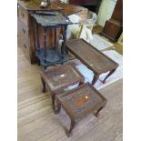 A nest of three Indian softwood carved coffee tables, with pierced foliate carving, largest 76cm