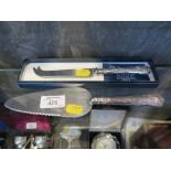 A silver handled cake knife, Sheffield 1979, together with a cheese knife 'The Posh Club' in box