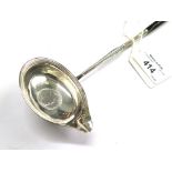 A silver punch ladle with inset Queen Anne shilling, London 1833