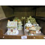 A collection of thirteen Staffordshire cottages and pastille burners, 19th century (13)