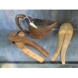 A Vintage Scandinavian wooden nutcracker modelled as a fish together with another pair and a