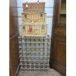 Three wicker hampers and a wine rack (4)