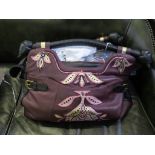 A Penhaligons Temperley Collection leather overnight bag, in purple, with dust cover, limited