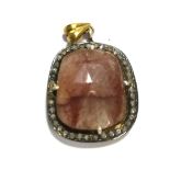 An unusual ruby and diamond pendant