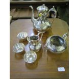 A three piece silver plated tea set and three plated cups