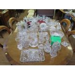 A large collection of glassware including decanters, dishes, candlesticks, glasses etc