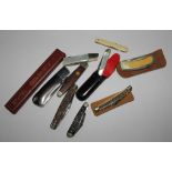 A collection of nine pen knives to include a cut throat razor