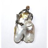 A diamond and blister pearl pendant