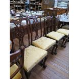 Two pairs of George III style mahogay dining chairs, each with pierced vase shape splats and