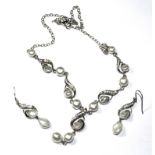 A Guernsey pearl and paste silver necklace and a pair of matching earrings together with an Amethyst