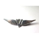 An aluminium brooch for sweethearts, with V for Victory and wings,