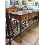 A crossbanded walnut side table, with three frieze drawers and moulded apron on cabriole legs and