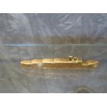 A brass trench art model of a ship, 10.2cm long