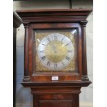 A George III mahogany longcase clock, the moulded cornice and pilasters enclosing a brass dial