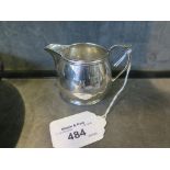 A small silver cream jug together with a matching two handled sugar basin, mixed dates