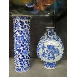 A Chinese blue and white cylindrical vase, depicting dragons among chrysanthemums, (chip and