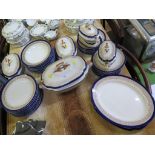 A late Victorian Royal Worcester dinner service with bird feet handles and blue border including
