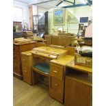 An Art Deco burr oak dressing table, the shaped mirror above a shaped drawer and a kneehole