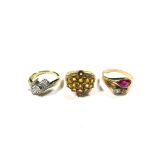 Three gem set rings to include diamond crossover diamond and red stone, etc