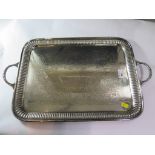 A large silver plated tray with ribbed border, decorated to centre, with carrying handles