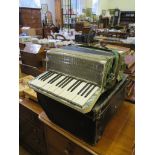 A Modello Francesco accordian, with green marbled effect case, 2.5 octave keyboard, 24 stops