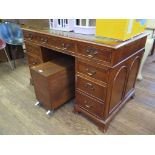 A yew veneered pedestal desk, the leather inset top over three drawers on pedestals, one with