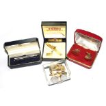 A collection of four vintage cufflinks and two tie pins