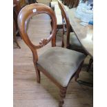 A set of four Victorian balloon back dining chairs with turned tapering legs (4)