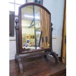 A late Victorian toilet mirror with carved frame and arched plate 75cm high 52cm wide, another