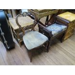 A Victorian carved walnut balloon back chair with cabriole legs, a wicker work occasional table, and