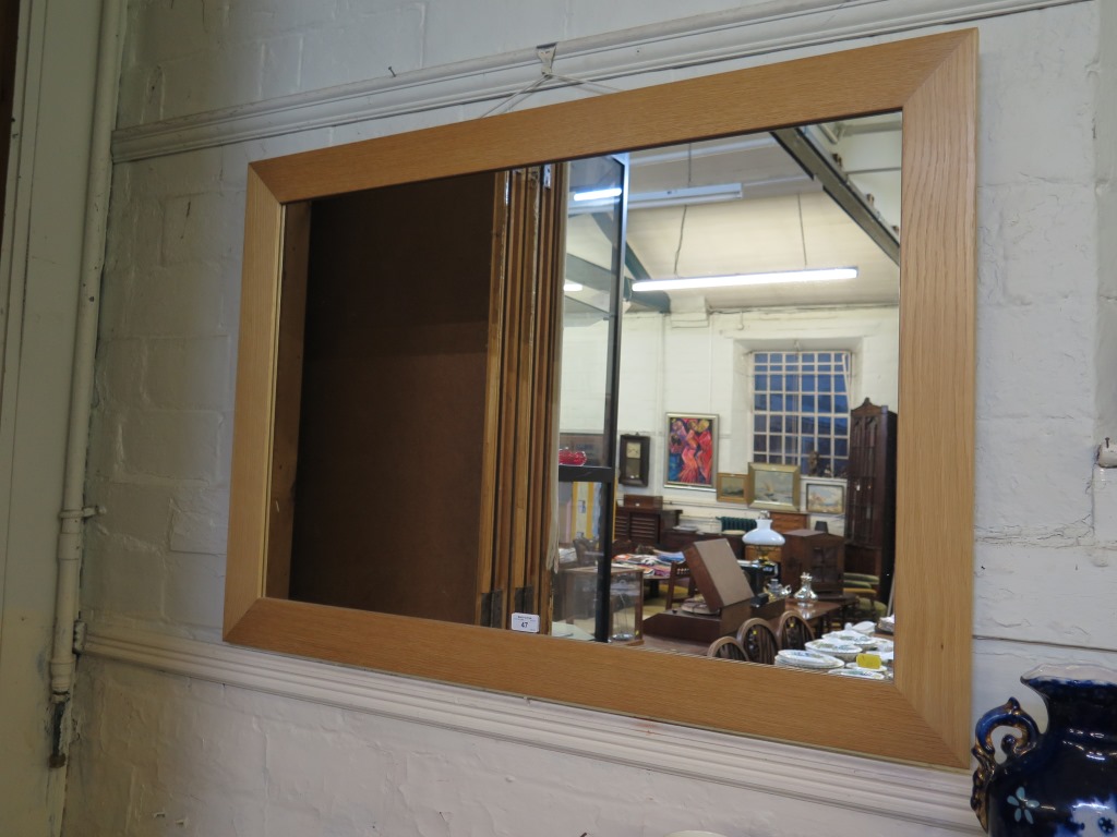 A light oak rectangular wall mirror 75cm x 105cm