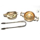 A silver mustard spoon, a pair of silver sugar tongs and a silver tea strainer, etc