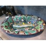 A Palissy Majolica dish depicting a fish amongst shells and amphibians, 37cm wide (cracked and